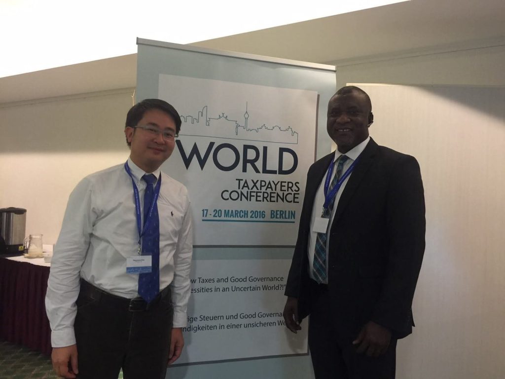 Hopeson Adorye with a fellow delegate at the World Taxpayers Conference, Berlin, 17–20 March 2016.