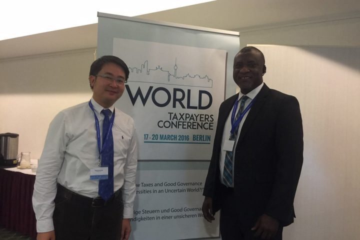 Hopeson Adorye with a fellow delegate at the World Taxpayers Conference, Berlin, 17–20 March 2016.