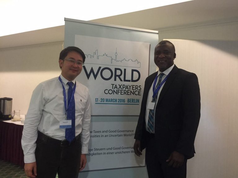 Hopeson Adorye with a fellow delegate at the World Taxpayers Conference, Berlin, 17–20 March 2016.